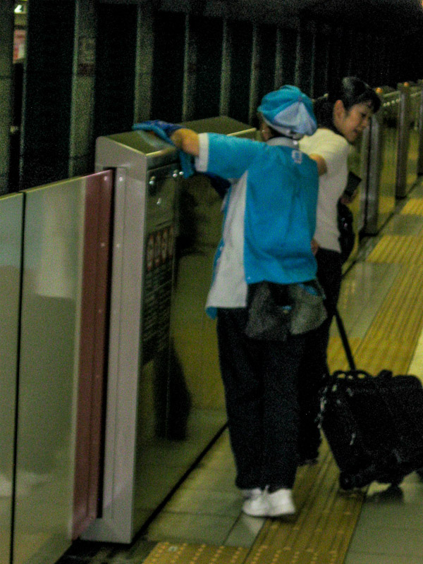 Subway worker cleaning