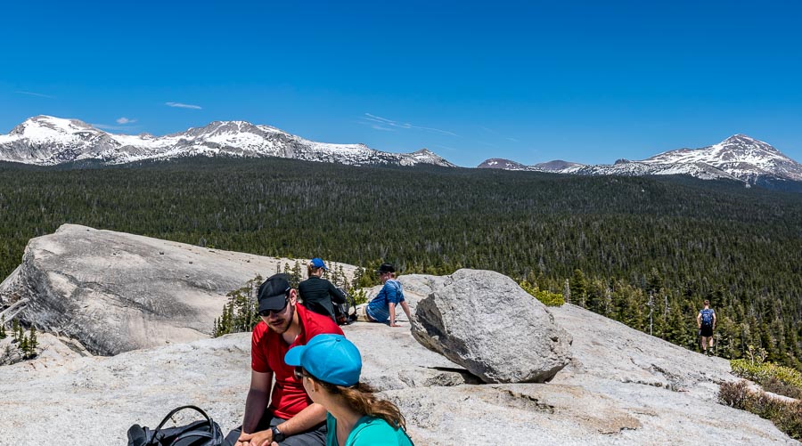 Hikers resting on top of Lembert Dome