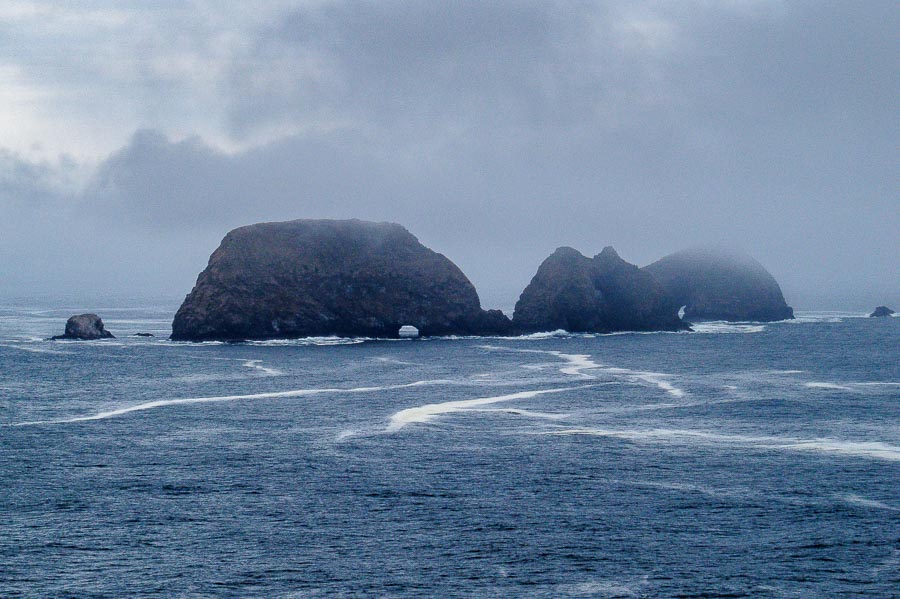 A closer view of the rock formations offshore