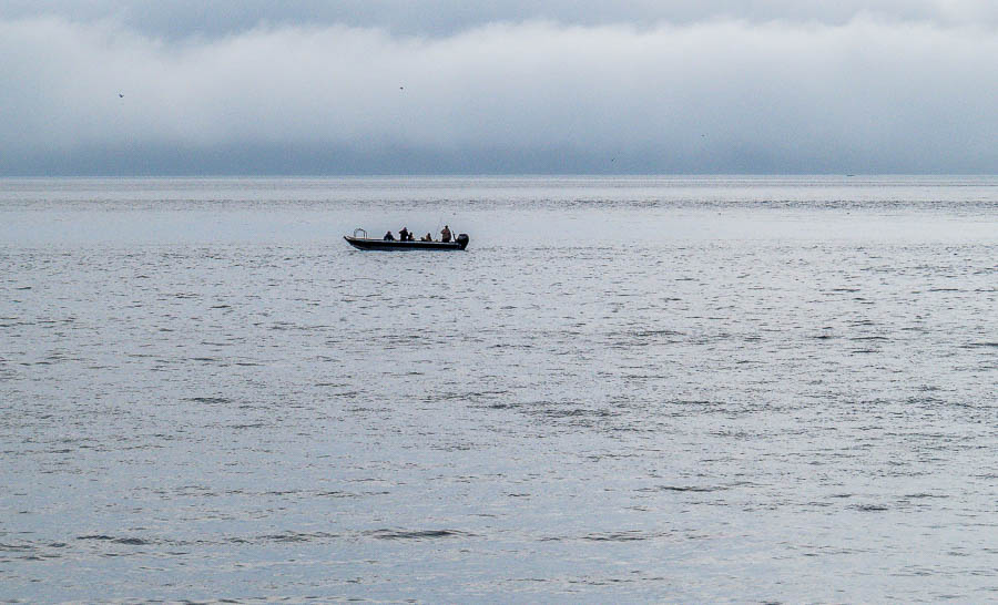 A boat with anglers heading home.