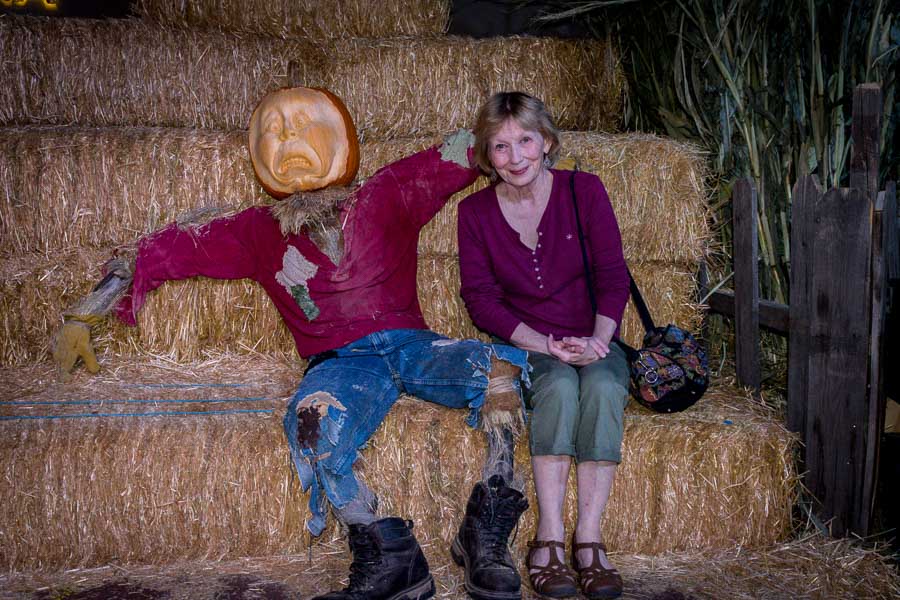 Have your picture taken atop hay bales with a pumpkin man
