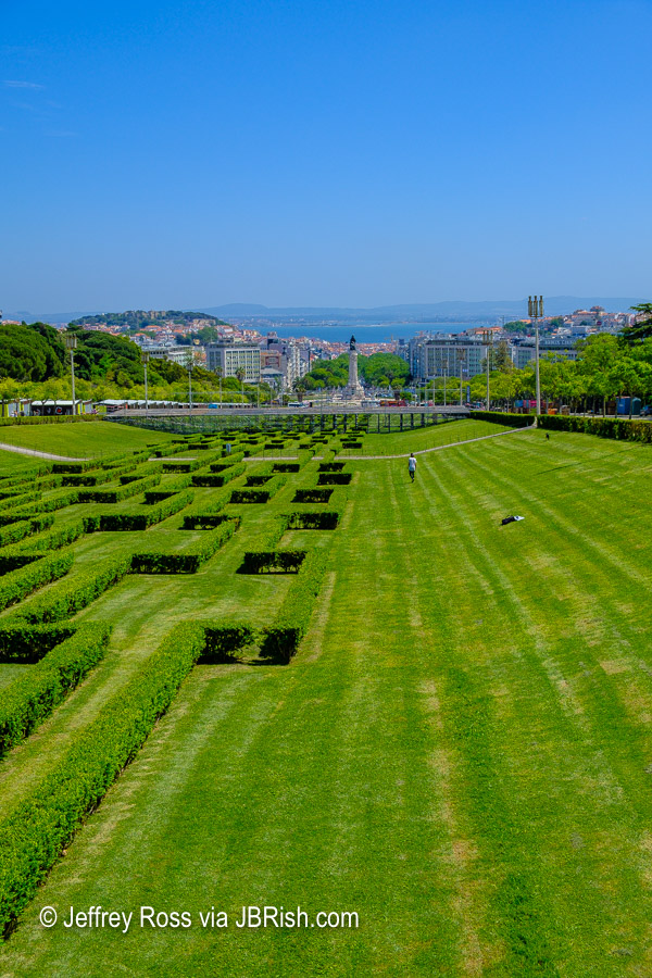 distant view of Alfama district and the Marques de Pombal statue from the Edward VII park