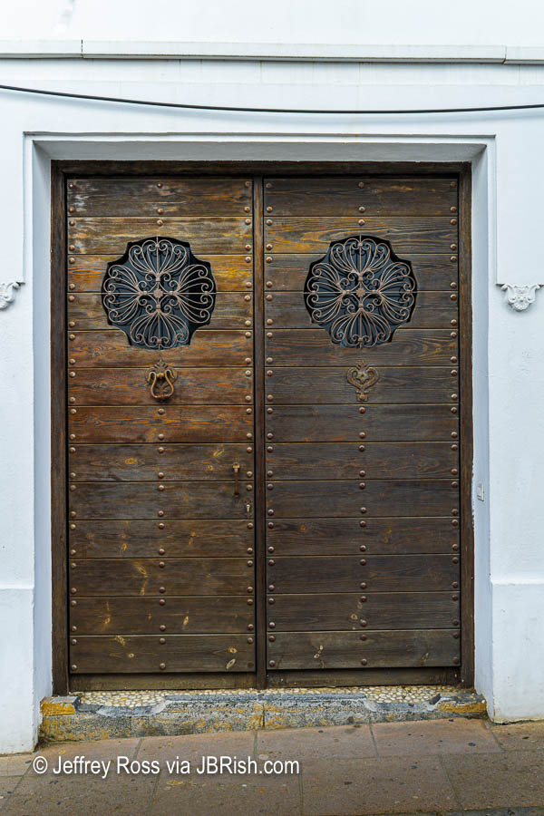 Aged wooden door with metal accents