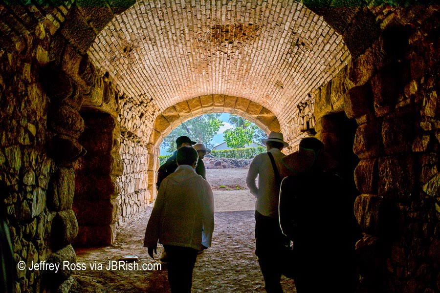 Tourists walking through Gladiator tunnel leading to the activity circle of the amphitheater