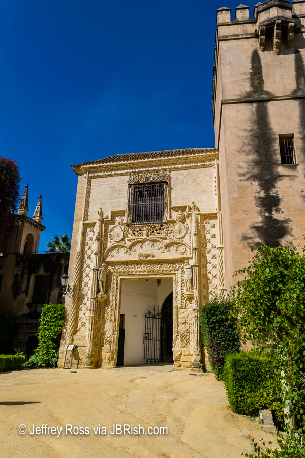Intricately carved stonework of the exit portal at the Alcazar's garden