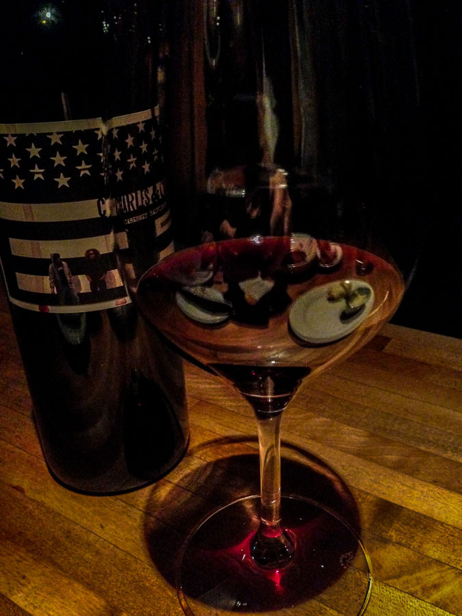 Reflections of Dinner in a wine glass