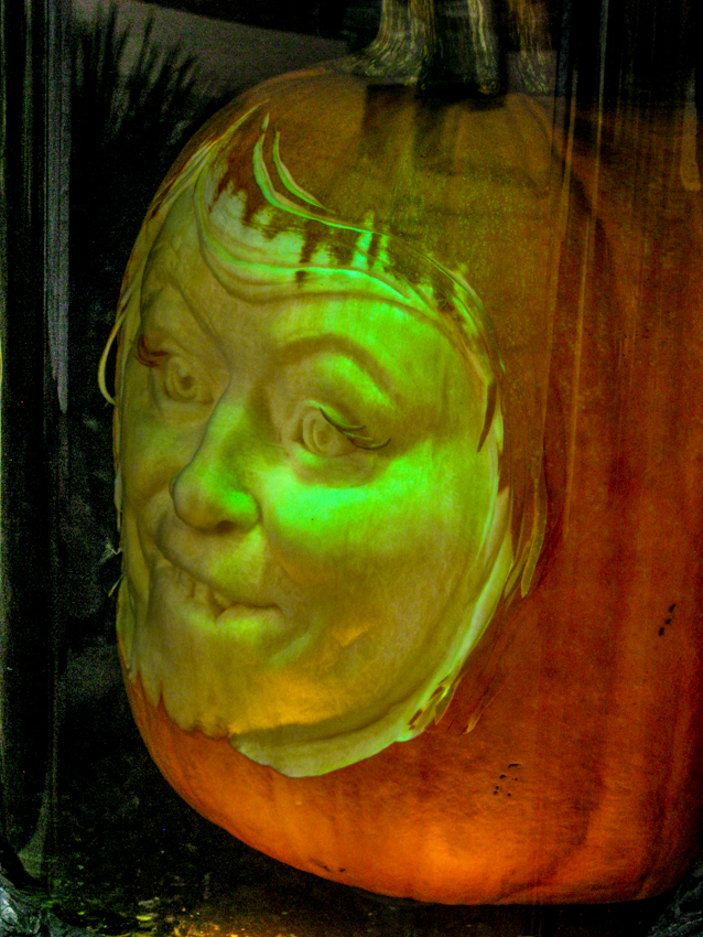 A carved pumpkin imp