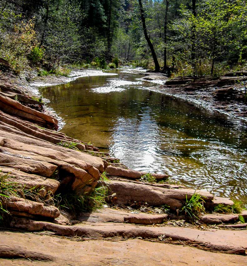 Contrast of stream and red rocks
