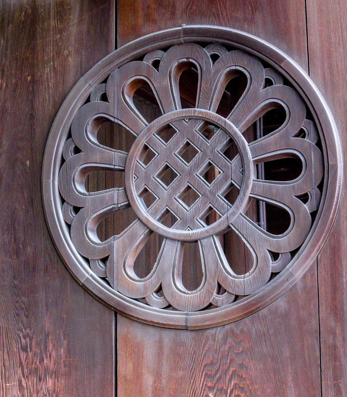 Carved wooden door medallion detail