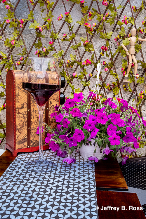 Restaurant table with flowers and wine